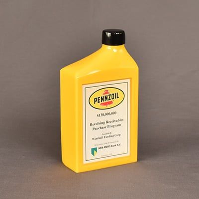 Cast Pennzoil® can made out of colored Lucite® with custom text on the label.